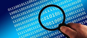 Reflection API - image of magnifying glass held over binary code