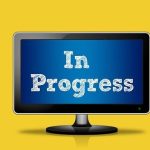 Three monitors displaying to do, in progress and done