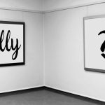 cartoon man looking at a painting of question marks