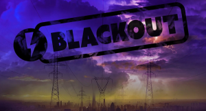 Load-shedding or grid collapse: landscape photo of electricity pylons with the word "blackout"