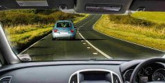 Do people code like they drive? Photo of a car from a driver's perspective.