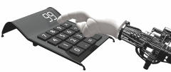 Image of a robotic hand using a calculator.