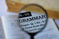 Language skills - magnifying glass over the word "grammar"