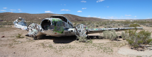Photo of a crashed plane in the desert.