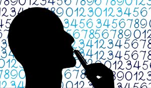 Silhouette of a head with numbers behind it