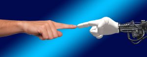 Turning points: image of a human hand touching a robotic hand
